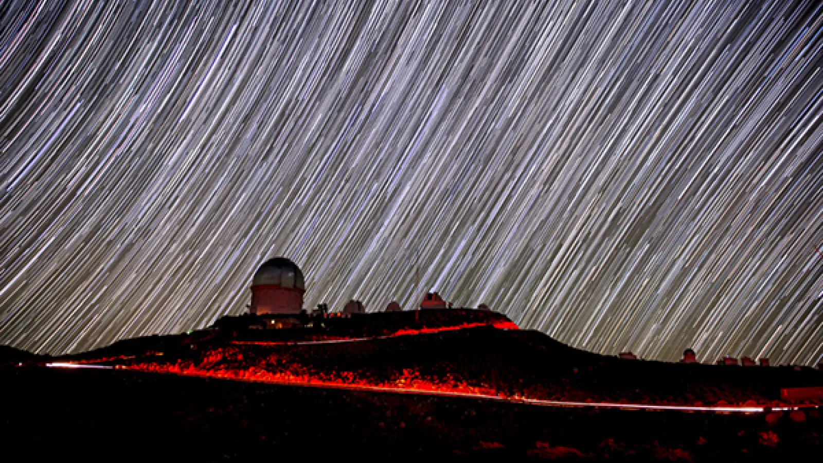 Cerro Tololo, Blanco Telescope dome — one of the telescopes used in the Dark Energy Survey — and star trails in Chile (Reidar Hahn, Fermilab)