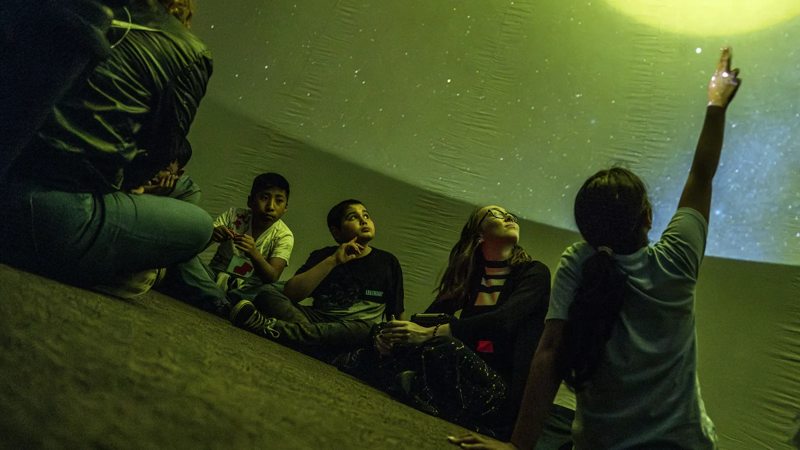 Caitlin O'Brien presenting inside planetarium