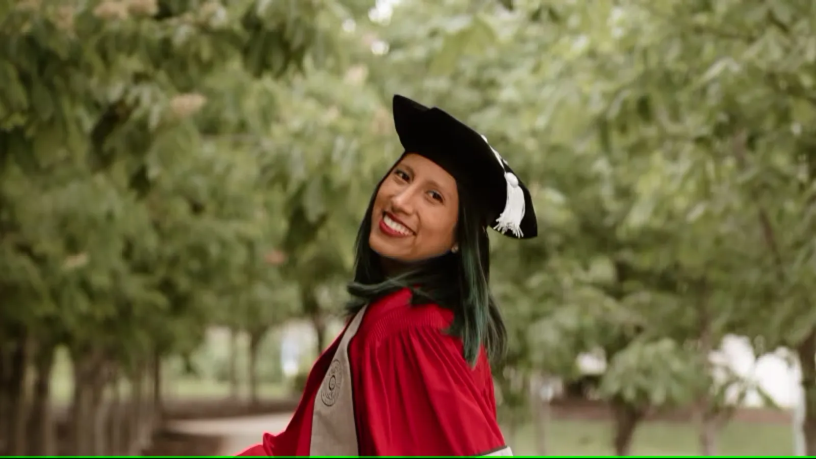 Daniella Roberts in graduation robes