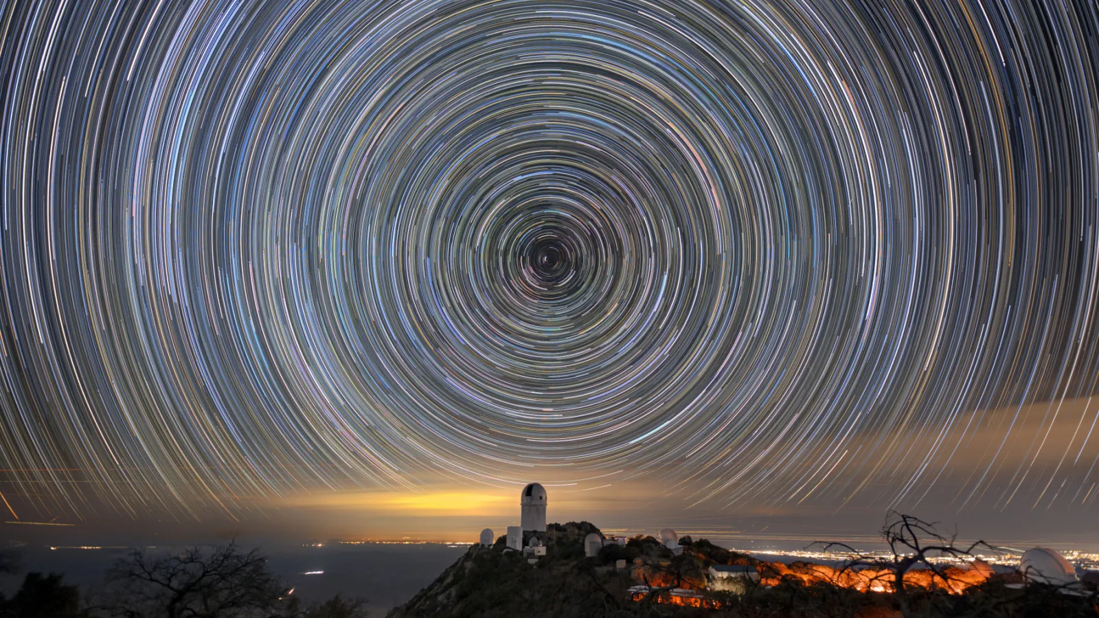 Star trails over the Mayall Telescope that houses DESI.