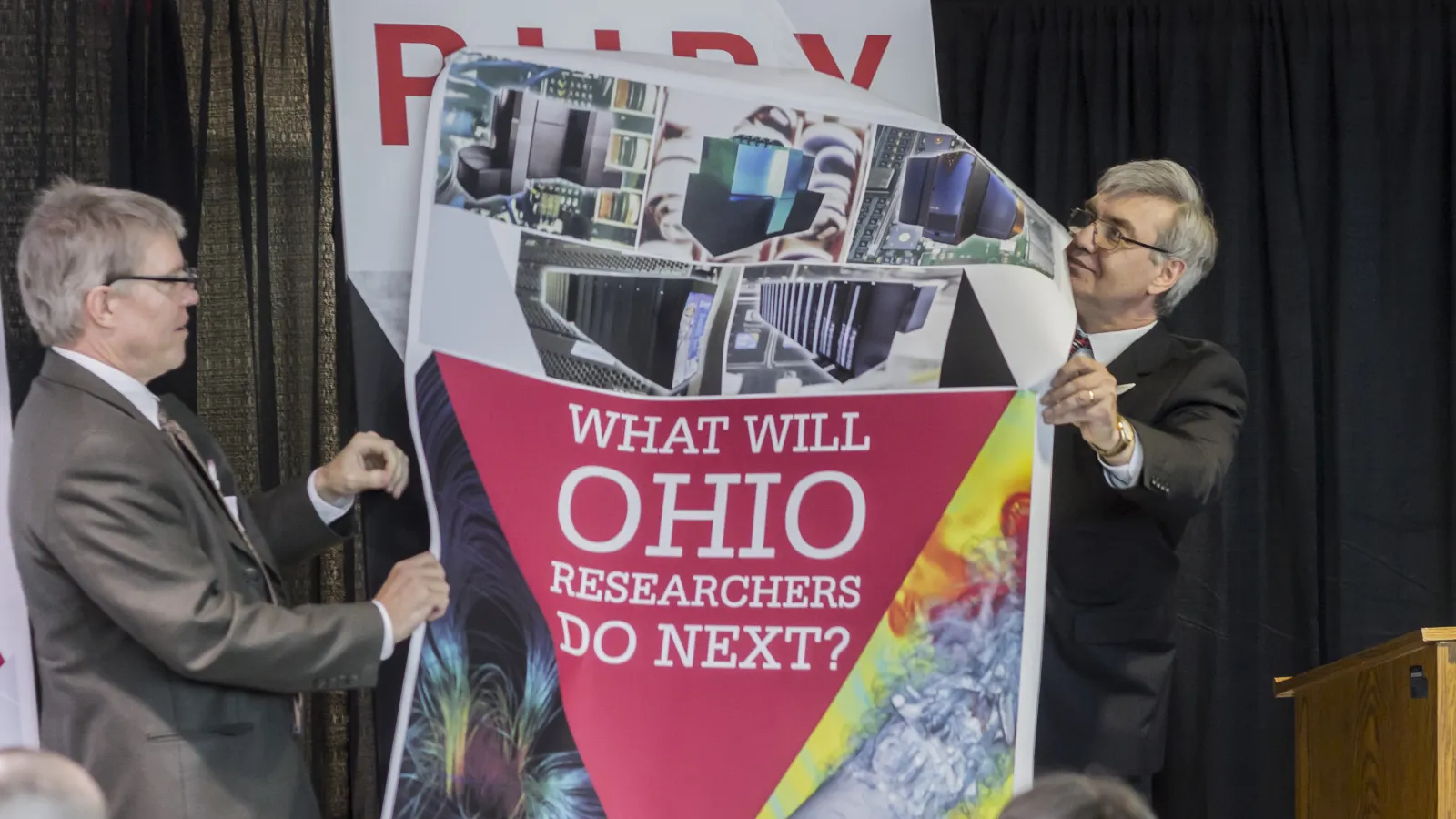 Chancellor John Carey and Statewide Users Group Chair Thomas Beck unveil Ruby Cluster name plate