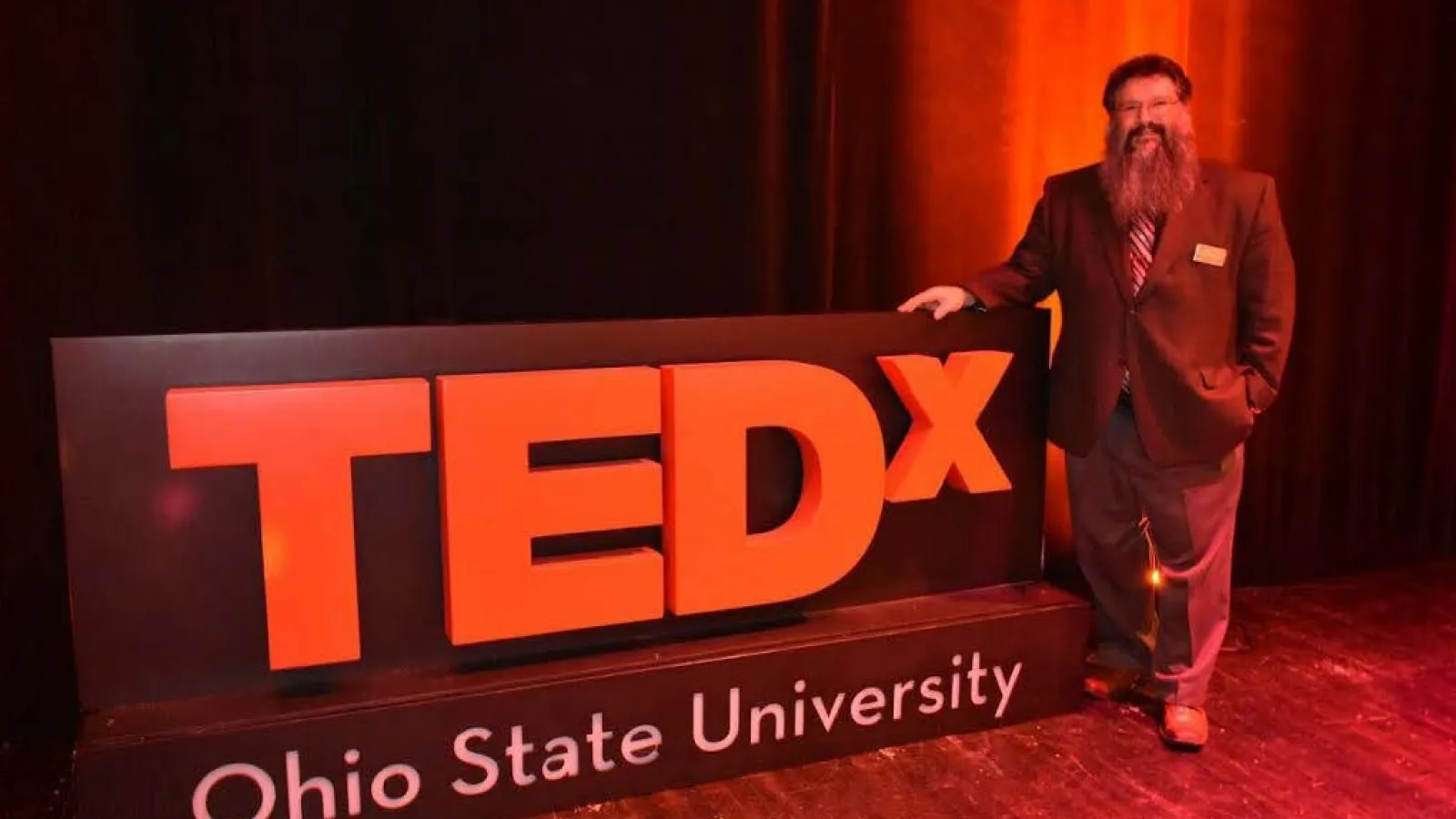 Dr. Michael Stamatikos Next to TEDx Sign
