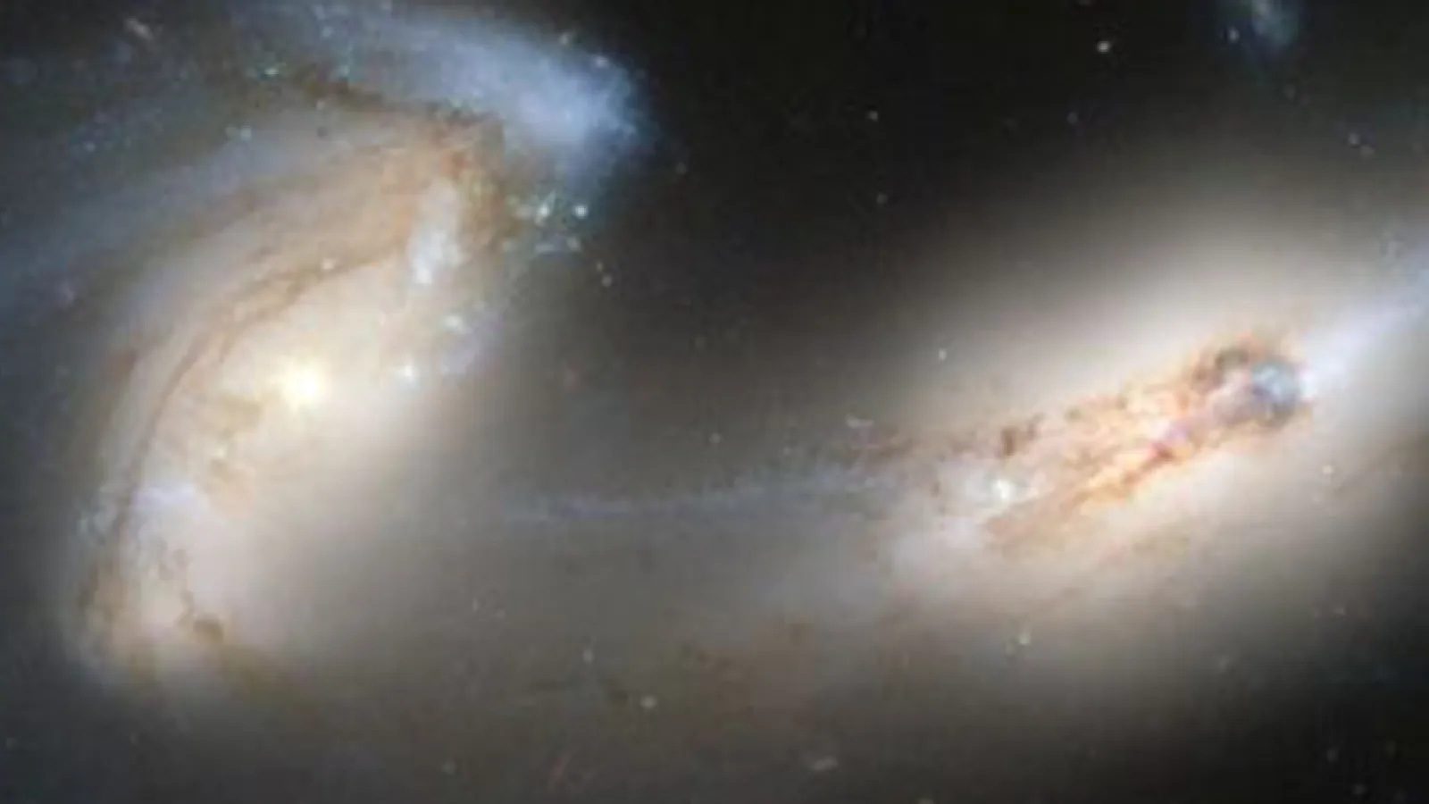 Two galaxies in the midst of colliding.