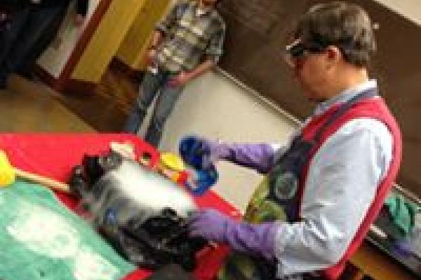 Demonstrator performing an experiment