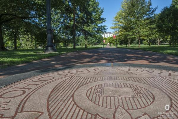 The seal of The Ohio State University on the Oval.